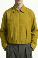 Yellow jacket worn by a person on a white background