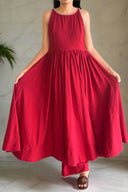 Red dress with intricate detailing on a neutral background