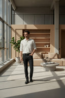 White checkered shirt with black buttons on a gray background